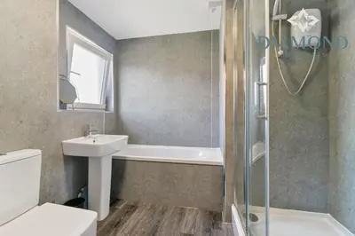 a bathroom with a toilet and a sink and a shower at Grangemouth, 3 Bed House, Free Parking, Business or Leisure in Grangemouth