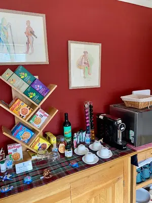 a counter with a coffee maker and a microwave at Rowan House B&B Rooms & A Self Catering Apartment in Lochgoilhead