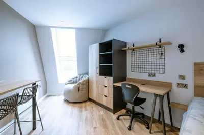 a bedroom with a desk and a bed at Modern Studio Apartments at Murieston Crescent in Edinburgh in Edinburgh