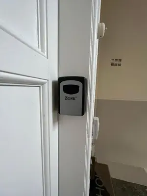 a door with a z nano sign on it at Dalblair Apartment in Ayr