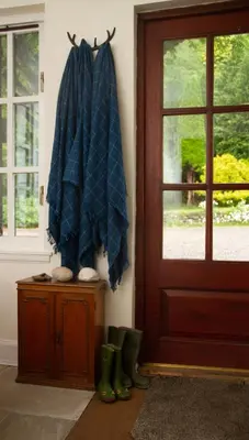 a room with a door and boots next to a door at Taychreggan, Signature Collection by Eight Continents in Oban
