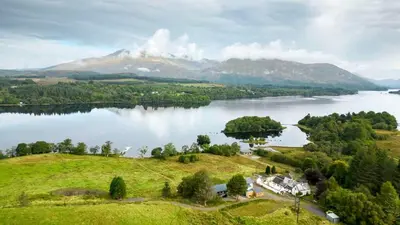 an aerial view of a lake with a mountain at New Build Lodge With Stunning Views of Loch Awe in Hayfield