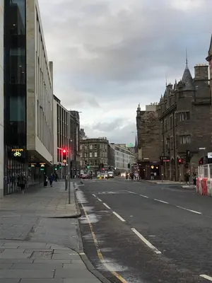 an empty city street with a red traffic light at Cosy one bedroom flat in city center in Edinburgh