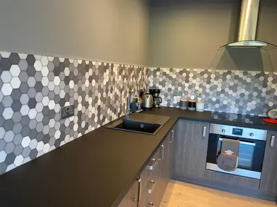 a kitchen with a sink and a counter top at The Granary in Stirling