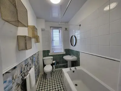 a bathroom with a toilet and a sink and a tub at 4 Bedrooms Apartment By Sensational Stay Short Lets & Serviced Accommodation in Edinburgh