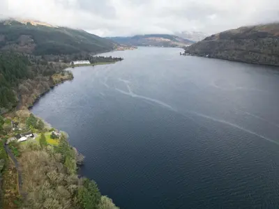 an aerial view of a large body of water at WATERSIDE 3 BED COTTAGE, HOT TUB, SAUNA, PVT BEACH in Arrochar
