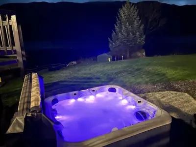 a purple bath tub with a cloud in the middle at WATERSIDE 3 BED COTTAGE, HOT TUB, SAUNA, PVT BEACH in Arrochar