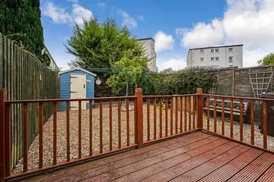 a wooden deck with a wooden fence at Centrally Situated 1 Bedroom House in Cumbernauld in Cumbernauld