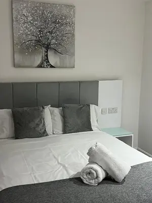 a bedroom with a bed with a towel on it at Crosskeys Edinburgh in Edinburgh