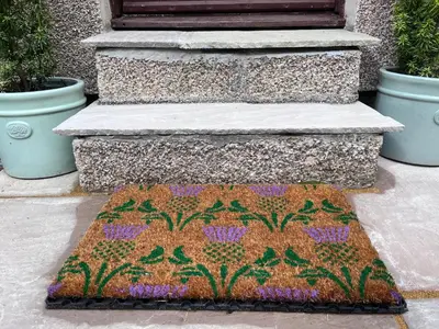 a rug on the ground in front of a building at Riverside Loft in Barcaldine