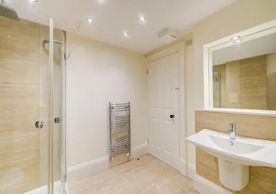 a bathroom with a sink and a shower at Super central Edinburgh Castle basement in Edinburgh