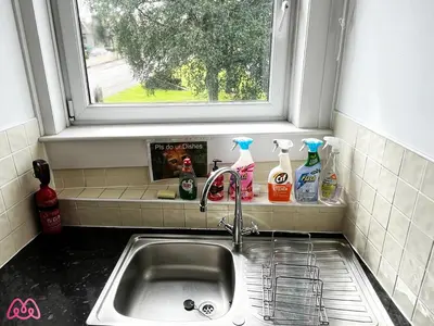 a kitchen sink with a window above it at 2 Bedrooms Entire Apartment Self Check in in Fife