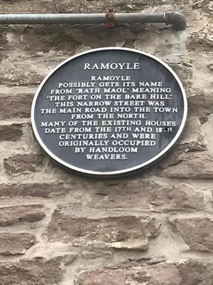 a sign on the side of a stone wall at 1Bed Golfhill Cottage in Dunblane