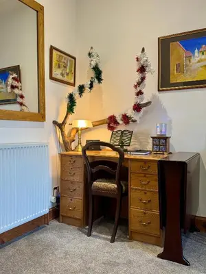 an office with a desk with a chair and a desk at 4B Millhill Street in Dunfermline