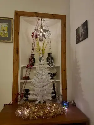 a white christmas tree sitting on a table at 4B Millhill Street in Dunfermline