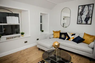 a living room with a couch and a glass table at 2 BDR House At Caledonia Luxe Stays Short Lets & Serviced Accommodation Crieff in Crieff