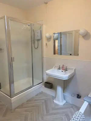 a bathroom with a shower and a sink at Fabulous 2 Bedroom House just outside Edinburgh in Auchendinny