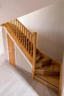 a wooden staircase in a room with a wall at Westertonhill Newbuild Lodges with Private Hot Tub Hire Available in Balloch