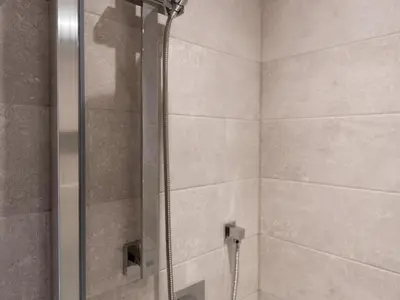 a shower with a glass door in a bathroom at Superb 1Bed Flat in Fabulous West End - Pass the Keys in Glasgow
