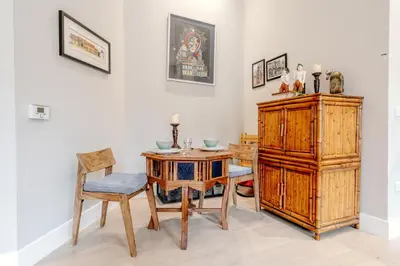 a dining room with a wooden table and chairs at Unique Two Bed Holiday Home in Edinburgh in Edinburgh