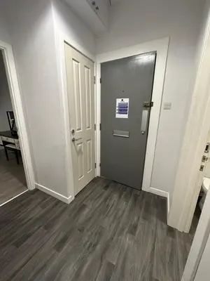 an empty room with a door and a hallway at One bedroom flat in Oban town centre in Oban