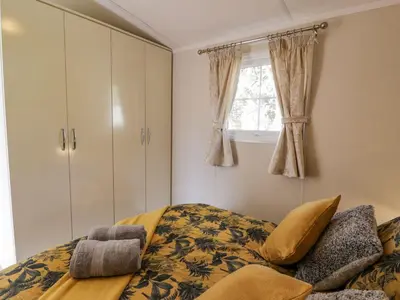a bedroom with a bed and a window at 11 Mansion View in Helensburgh