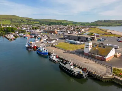 an aerial view of boats docked in a harbor at Kitty's Cottage in Girvan