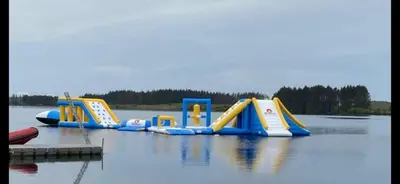 a row of inflatable slides in a body of water at Loch Heron View in Newton Stewart