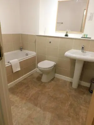 a bathroom with a toilet and a sink at Fabulous 2 bed apt 10 mins from City Centre in Glasgow