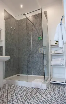 a shower with a glass door in a bathroom at Coorie in Dunfermline