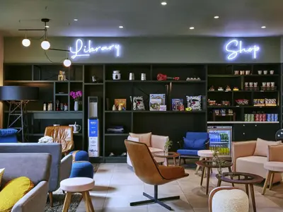 a store with chairs and tables in a room at Aparthotel Adagio Glasgow Central in Glasgow