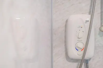 a remote control on a wall in a room at Monicas Apartment Lovely ground floor 2 bedroom serviced apartment in Coatbridge