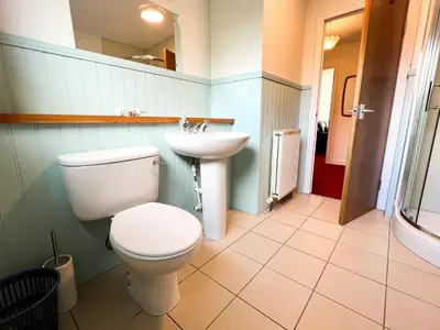 a bathroom with a toilet and a sink at Anniesland Glasgow 1bd Flat - Free Parking in Glasgow