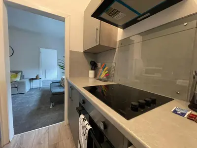 a kitchen with a sink and a counter top at Cardonald House in Glasgow