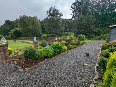 a garden with a stone path and plants at Bonnyside House in Bonnybridge