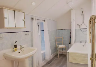 a bathroom with a sink and a tub and a toilet at Creran Apartment, Kinlochlaich House in Appin