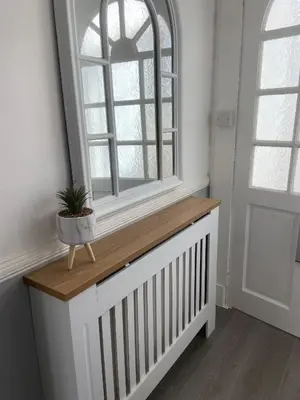 a window sill with a potted plant in a room at The Princess Flat, Helensburgh. in Helensburgh