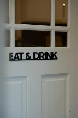 a sign on the door of an eat and drink restaurant at The Nest - small double room nr Glencoe in Ballachulish