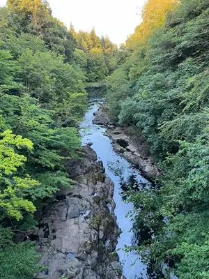 a river in the middle of a forest at The Keep at Craigiehall in Edinburgh