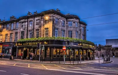 a building on the corner of a street at 1 Bedrooms Flat in Central Edinburgh Haymarket, Heart of Edinburgh Flat Sleeps 4 , in Edinburgh