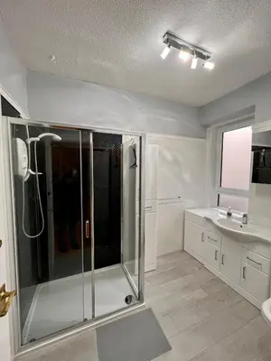 a bathroom with a shower and a sink at Anchorage, a lovely 2nd floor one bedroom apartment with fabulous seaviews in Largs