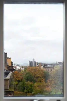 a view of a city from a window at The Penthouse Suite - Luxury Like No Other in Glasgow