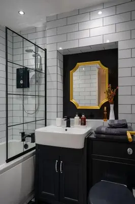 a bathroom with a sink and a mirror at The City Escape - 5* stay in the heart of Glasgow! in Glasgow