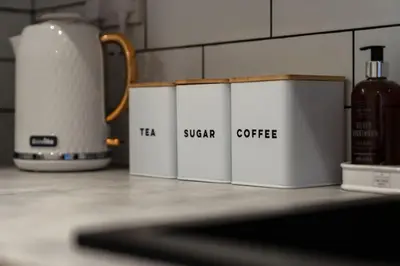 a group of four white containers sitting on a counter at The City Escape - 5* stay in the heart of Glasgow! in Glasgow