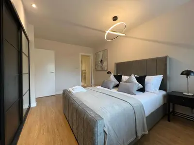 a bedroom with a large bed in a room at Stunning Apartment at Glasgow Hydro & SECC - Glasg in Glasgow