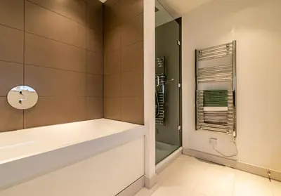 a bathroom with a shower and a sink at Simpsons Loan - 428 in Edinburgh