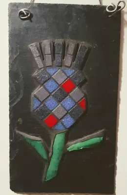 a picture of a hand painted on a wall at Cosy 3 bedroom home in centre of Brodick in Brodick