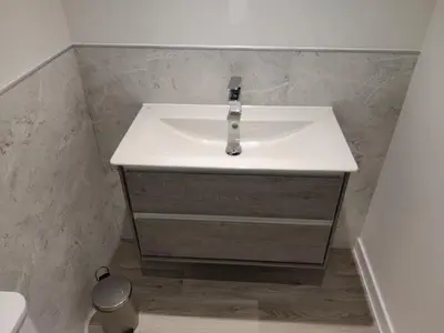 a bathroom with a sink and a toilet at No 7 Westbay Apartment in Oban