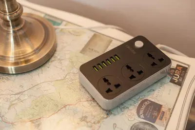 a remote control sitting on top of a map at The Distillers Den in Oban
