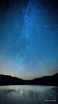 a starry night with a waterfall in the foreground at The Coorie in Bargrennan
